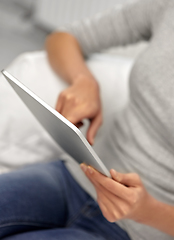 Image showing close up of woman with tablet pc computer at home