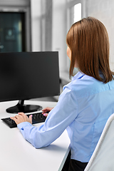 Image showing businesswoman with computer working at office