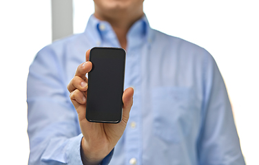 Image showing businessman showing smartphone screen