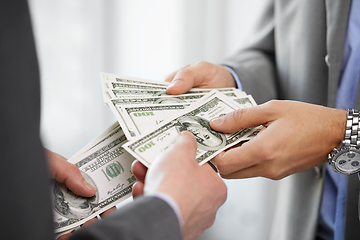 Image showing close up of businessmen's hands holding money