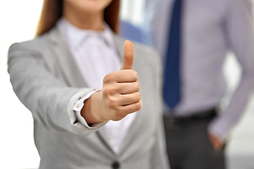 Image showing close up of businesswoman showing thumbs up