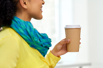 Image showing close up of woman holding takeaway coffee cup