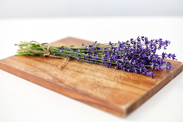 Image showing bunch of lavender flowers on wooden board