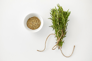 Image showing fresh and dry rosemary on white background