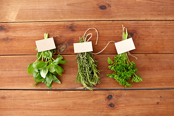 Image showing greens, spices or medicinal herbs on wooden boards