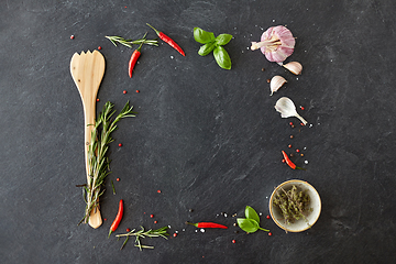 Image showing rosemary, garlic and chili pepper on stone surface