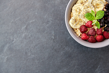 Image showing cereal breakfast with berries, banana and mint