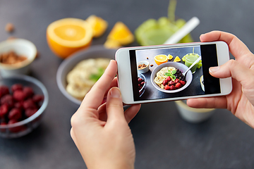 Image showing hands taking picture of breakfast with smartphone