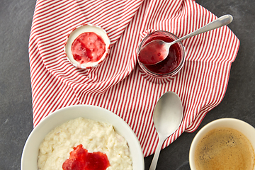 Image showing porridge breakfast with jam, spoon and coffee