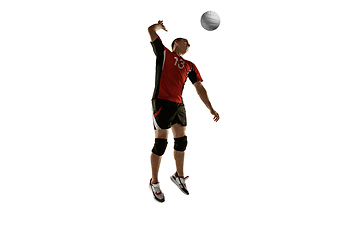 Image showing Young caucasian volleyball player placticing isolated on white background