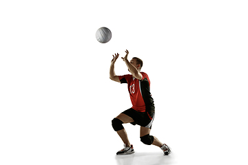 Image showing Young caucasian volleyball player placticing isolated on white background