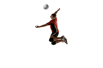 Image showing Young caucasian volleyball player placticing isolated on white background