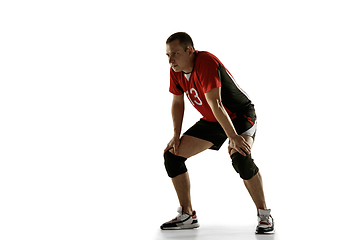 Image showing Young caucasian volleyball player placticing isolated on white background