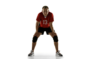 Image showing Young caucasian volleyball player placticing isolated on white background