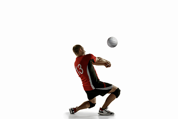 Image showing Young caucasian volleyball player placticing isolated on white background