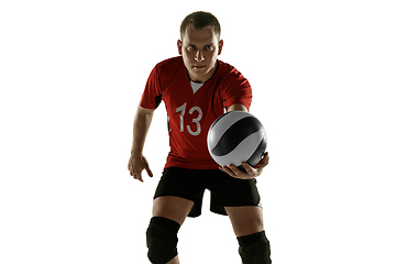 Image showing Young caucasian volleyball player placticing isolated on white background