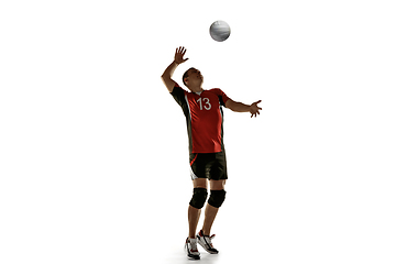 Image showing Young caucasian volleyball player placticing isolated on white background