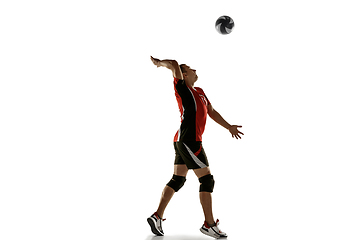 Image showing Young caucasian volleyball player placticing isolated on white background