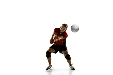 Image showing Young caucasian volleyball player placticing isolated on white background