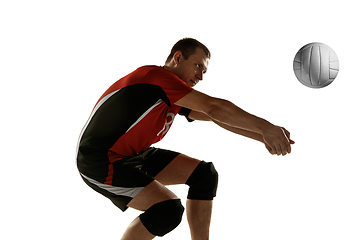 Image showing Young caucasian volleyball player placticing isolated on white background