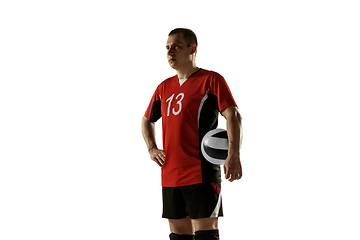 Image showing Young caucasian volleyball player placticing isolated on white background