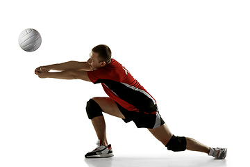 Image showing Young caucasian volleyball player placticing isolated on white background