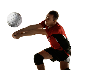 Image showing Young caucasian volleyball player placticing isolated on white background