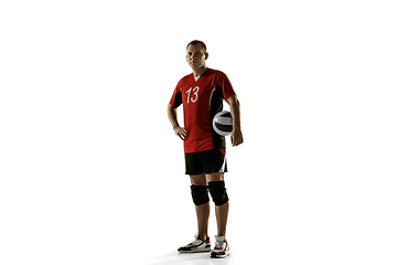 Image showing Young caucasian volleyball player placticing isolated on white background