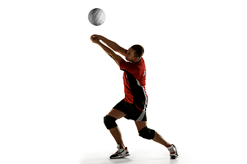 Image showing Young caucasian volleyball player placticing isolated on white background