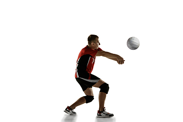 Image showing Young caucasian volleyball player placticing isolated on white background