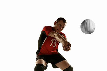 Image showing Young caucasian volleyball player placticing isolated on white background