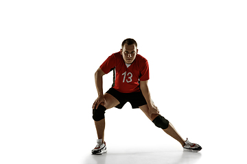 Image showing Young caucasian volleyball player placticing isolated on white background