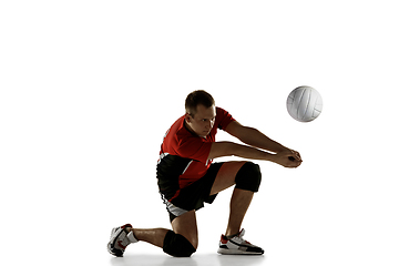 Image showing Young caucasian volleyball player placticing isolated on white background