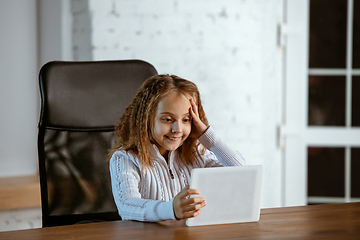 Image showing Portrait of young caucasian girl in casual clothes looks dreamful and happy