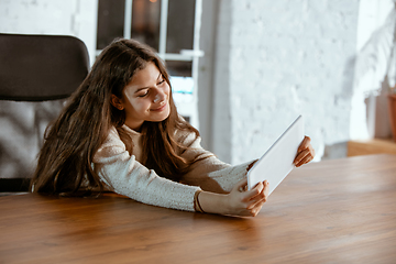 Image showing Portrait of young caucasian girl in casual clothes looks dreamful and happy