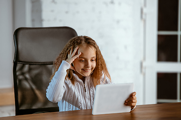 Image showing Portrait of young caucasian girl in casual clothes looks dreamful and happy