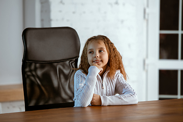 Image showing Portrait of young caucasian girl in casual clothes looks dreamful and happy