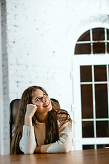 Image showing Portrait of young caucasian girl in casual clothes looks dreamful and happy