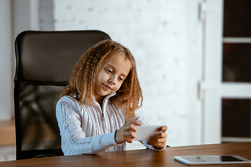 Image showing Portrait of young caucasian girl in casual clothes looks dreamful and happy