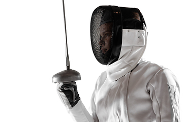 Image showing Teen girl in fencing costume with sword in hand isolated on white background