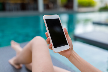 Image showing Using cellphone in swimming pool