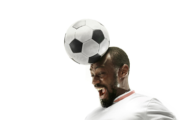 Image showing Close up of emotional man playing soccer hitting the ball with the head on isolated white background