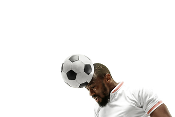 Image showing Close up of emotional man playing soccer hitting the ball with the head on isolated white background