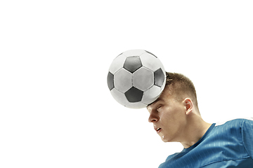 Image showing Close up of emotional man playing soccer hitting the ball with the head on isolated white background