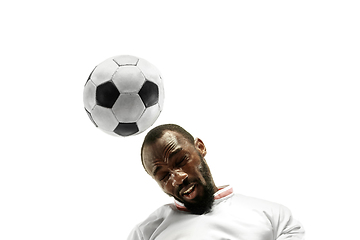 Image showing Close up of emotional man playing soccer hitting the ball with the head on isolated white background