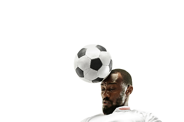 Image showing Close up of emotional man playing soccer hitting the ball with the head on isolated white background