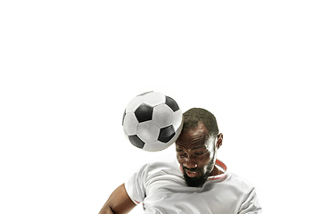 Image showing Close up of emotional man playing soccer hitting the ball with the head on isolated white background