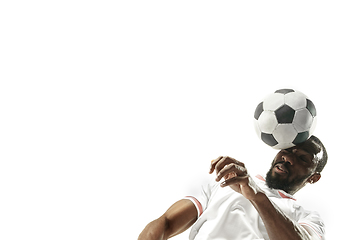 Image showing Close up of emotional man playing soccer hitting the ball with the head on isolated white background