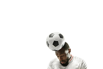 Image showing Close up of emotional man playing soccer hitting the ball with the head on isolated white background