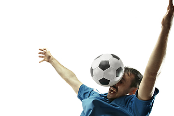 Image showing Close up of emotional man playing soccer hitting the ball with the head on isolated white background